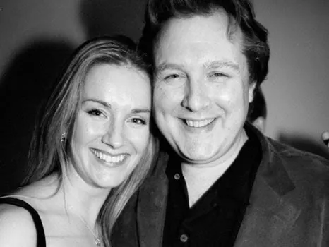 Black and white photo of Miriam and Alex, cheek to cheek and smiling